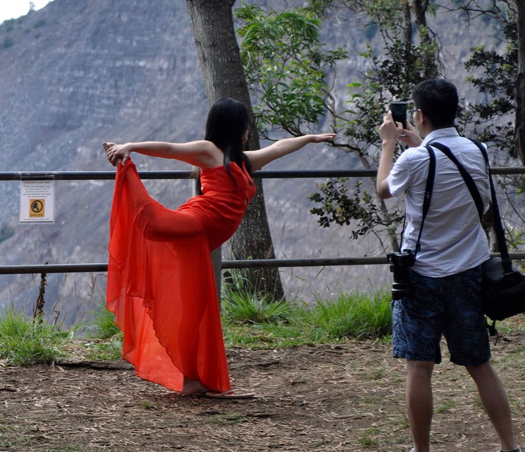 Artists/Dancer in Red Dress at Volcano National Park - photo by Glenn McClure